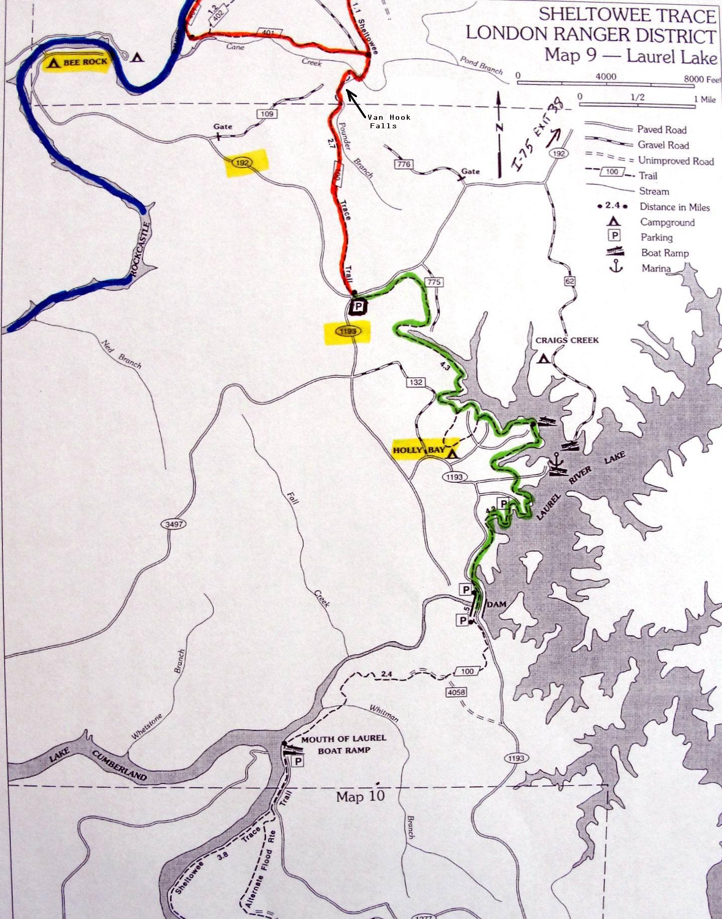 Map of Sheltowee Trace in the London Ranger District, highlighting Laurel Lake. It features marked trails, roads, and points of interest including Bee Rock, Holly Bay, and Van Hook Falls, along with key landmarks such as campgrounds, parking areas, and a boat ramp. The map includes various colors indicating different types of paths and provides a scale for distance. Cane Creek (sheltowee Trace Trail) mountain bike trail.