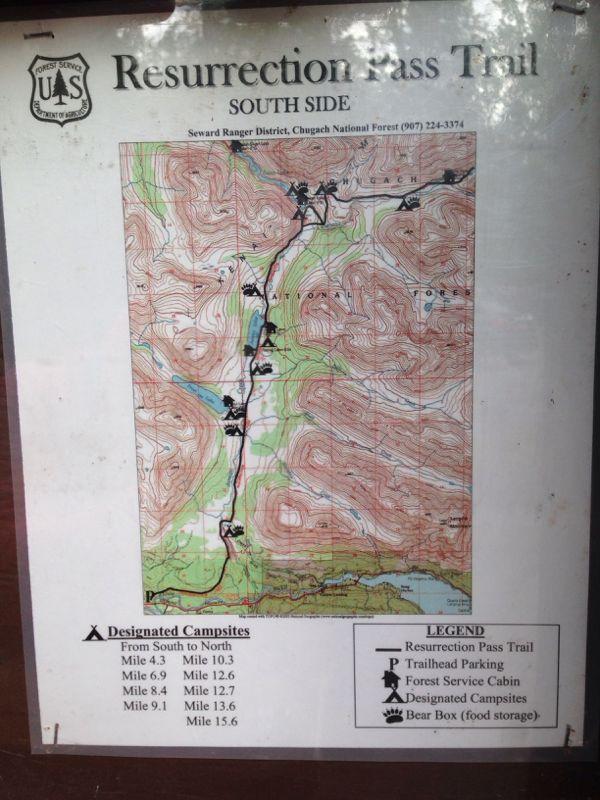 Map of the Resurrection Pass Trail, South Side, displaying trail details, designated campsites with mile markers, and various landmarks such as parking areas and bear boxes. The map includes topographical information, with contour lines indicating elevation changes. Resurrection Pass mountain bike trail.