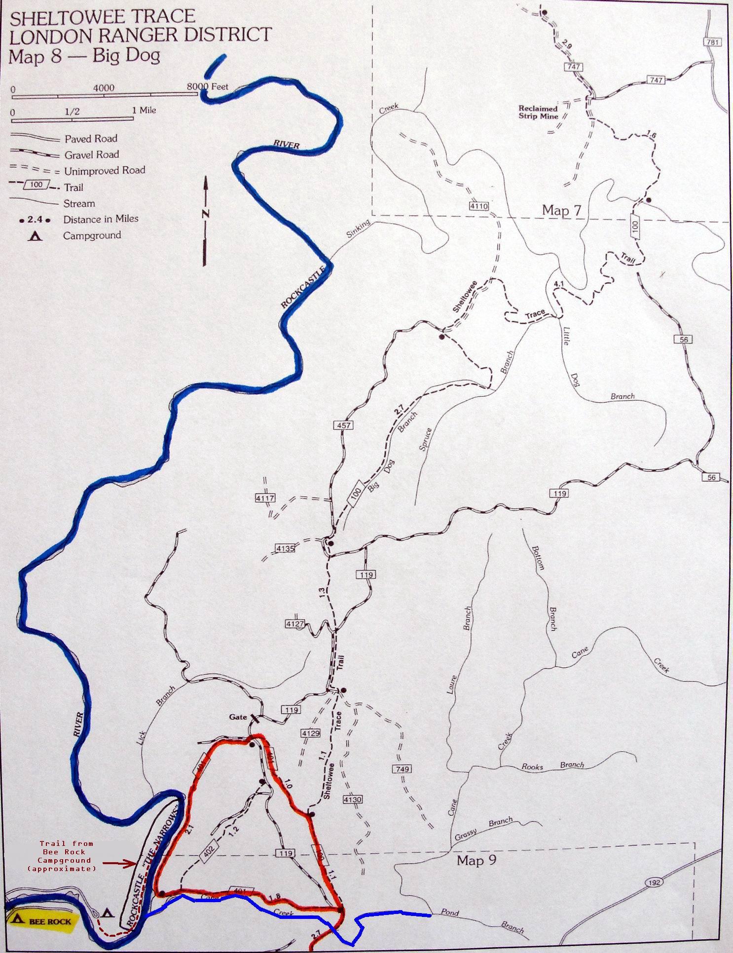 Map showing Sheltowee Trace in the London Ranger District, labeled as Map 8 - Big Dog. The map illustrates various routes including paved roads, gravel roads, unimproved roads, trails, and streams. Key landmarks include the Rockcastle River, campgrounds, and the Bee Rock Campground trail, with an approximate distance scale and directional indicator. Cane Creek (sheltowee Trace Trail) mountain bike trail.