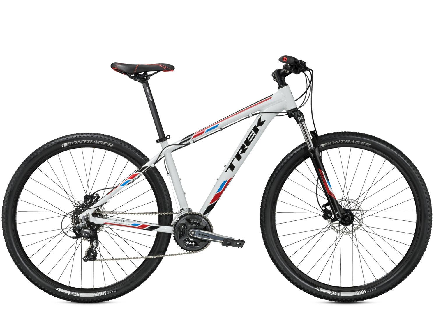 Trek Marlin: A white and red Trek mountain bike with a black saddle, front suspension, and Bontrager wheels, viewed from the side. The bike features a lightweight frame and a gear system, designed for off-road cycling.