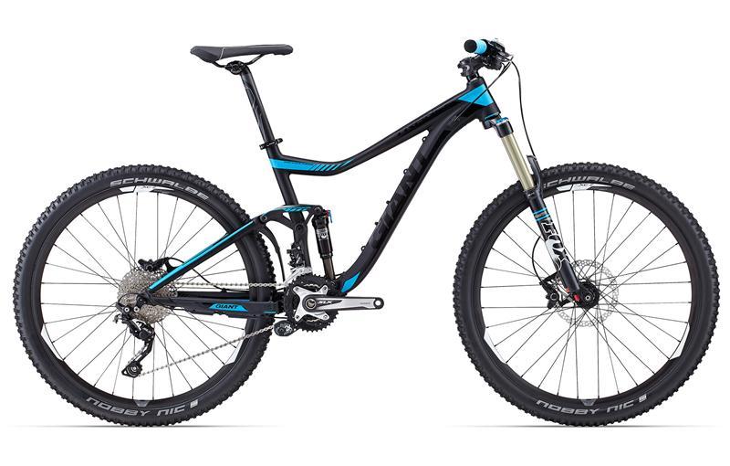 Giant Trance 27.5 sx: A modern mountain bike with a sleek black and blue design, featuring robust tires, a full suspension frame, and high-quality components suitable for off-road riding.