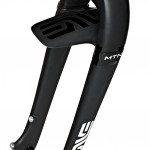 Image of a mountain bike fork featuring a sleek black design with visible branding. The fork has a sturdy build and includes a suspension feature.