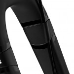Close-up view of a black bicycle fork, showcasing its sleek design and smooth contours.