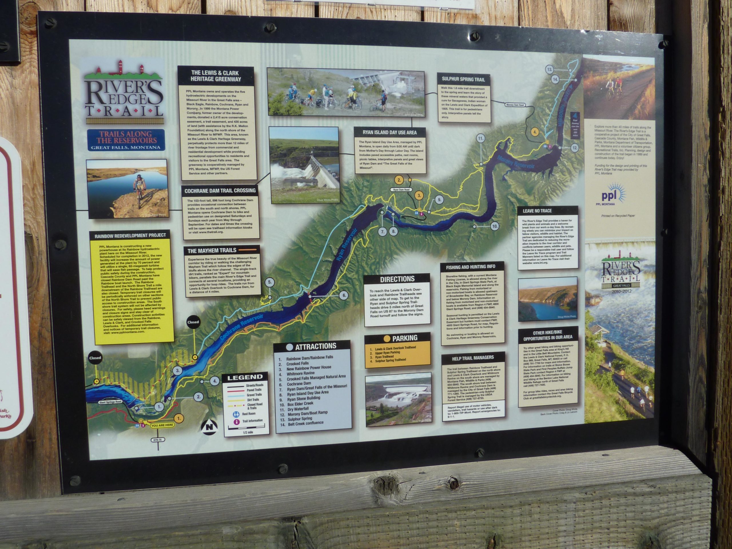 Map of the River's Edge Trail in Great Falls, Montana, featuring trails along the reservoirs, with details on attractions, directions, and information about fishing and hunting. The map includes illustrations and highlights key areas such as the Cochrane Dam Trail Crossing and the Lewis & Clark Heritage Greenway. South Shore Trail System mountain bike trail.