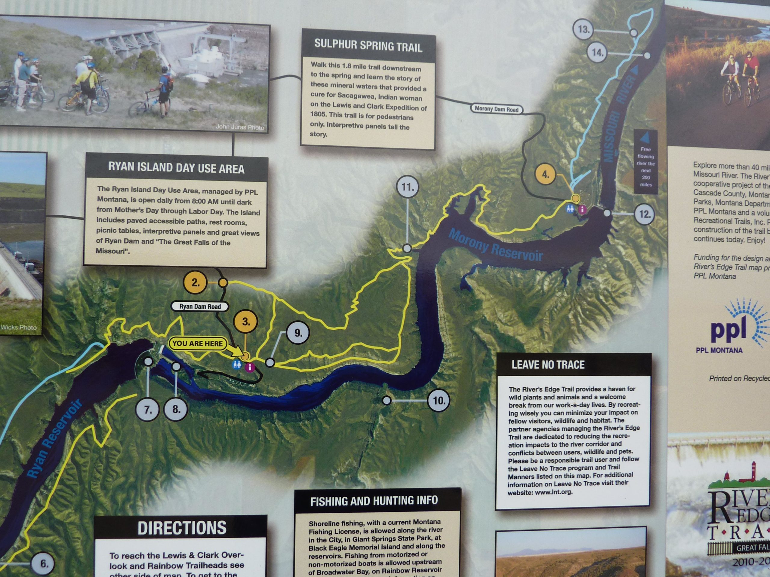 Map detailing the Ryan Island Day Use Area, Sulphur Spring Trail, and Morony Reservoir in Montana. The map includes key features such as directions, park information, and recreational guidelines, with highlighted trails, points of interest, and a "You Are Here" marker. North Shore mountain bike trail.