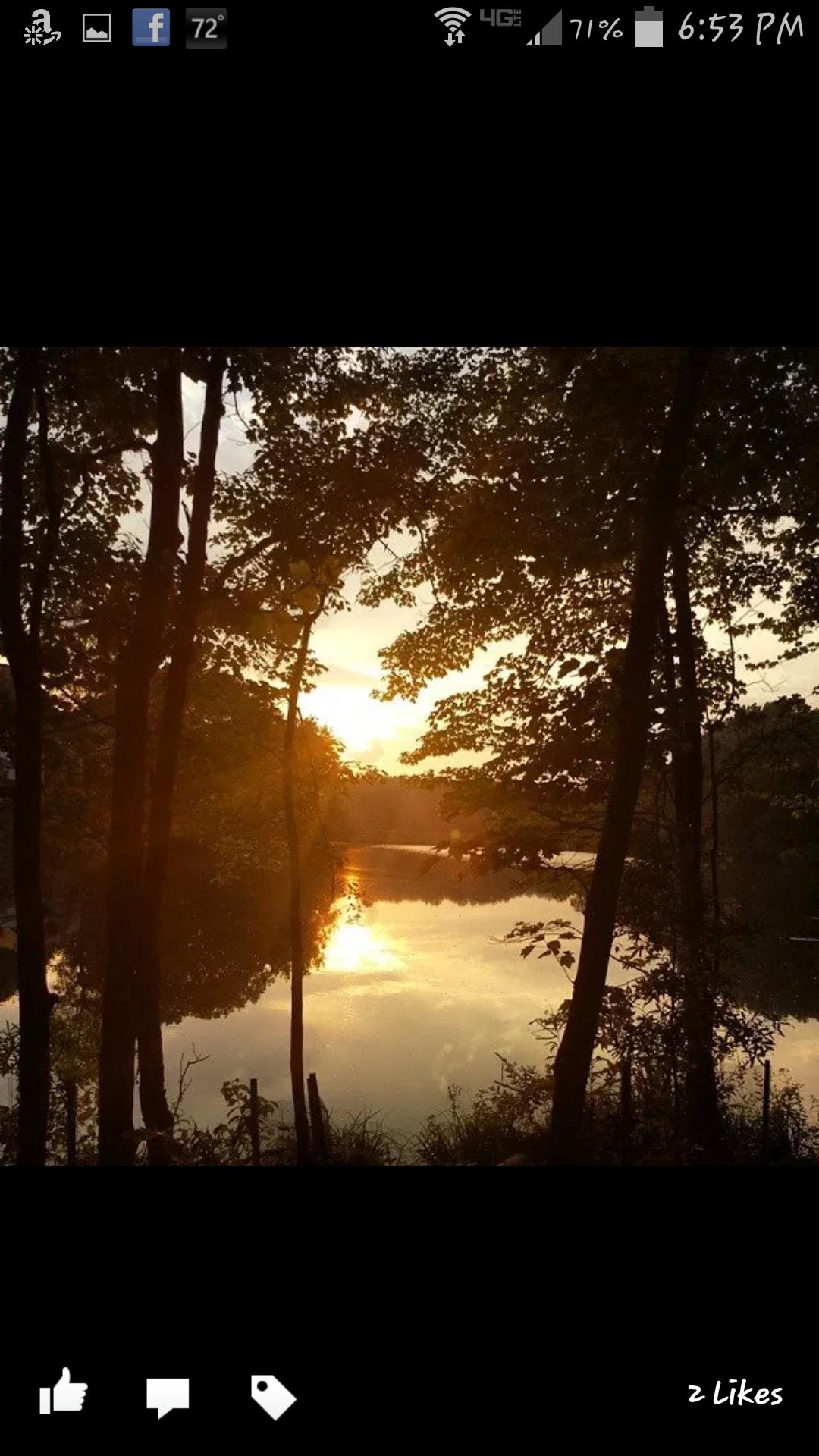 Trek 4500: A serene sunset over a calm lake, surrounded by lush trees. The golden light reflects off the water, creating a peaceful and picturesque scene.