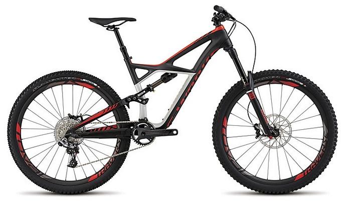 Specialized Enduro S-Works 650b: A modern mountain bike featuring a sleek black and red design, dual suspension, and wide tires suitable for off-road trails. The bike has disc brakes, a lightweight frame, and is positioned on a white background.