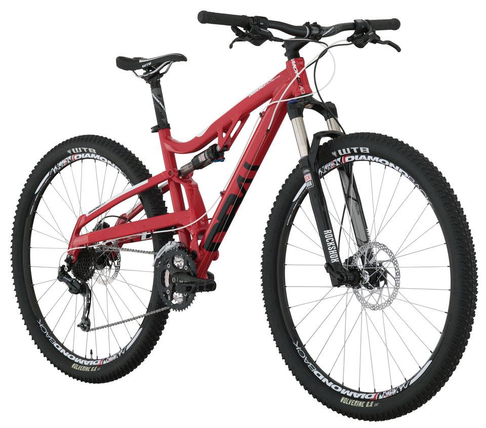 Diamondback Recoil Pro 29er: A red mountain bike featuring a dual suspension frame, wide tires, and disc brakes. The bike has a modern design suitable for off-road cycling, with components from brands like WTB and RockShox.