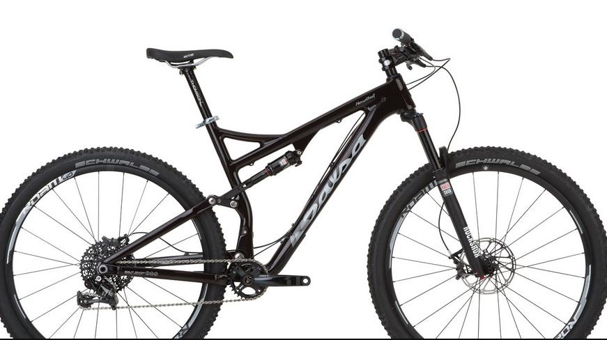 Salsa Horsethief Carbon 1: Mountain bike with a black frame, dual suspension, and wide tires, designed for off-road cycling. The bike features a modern design with a prominent brand logo, a front suspension fork, and disc brakes for enhanced performance on rugged terrain.