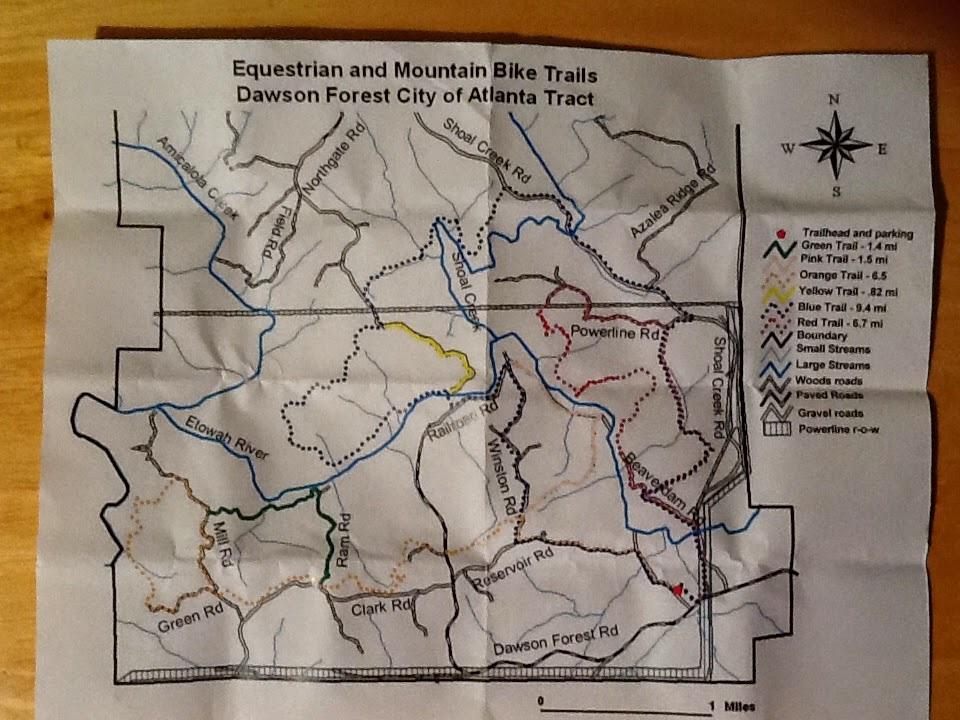 Map of equestrian and mountain bike trails in the Dawson Forest City of Atlanta Tract, featuring various colored trails, key landmarks, and roadways. The map includes a legend indicating trail lengths and types, as well as features like streams and parking areas. Dawson Forest mountain bike trail.