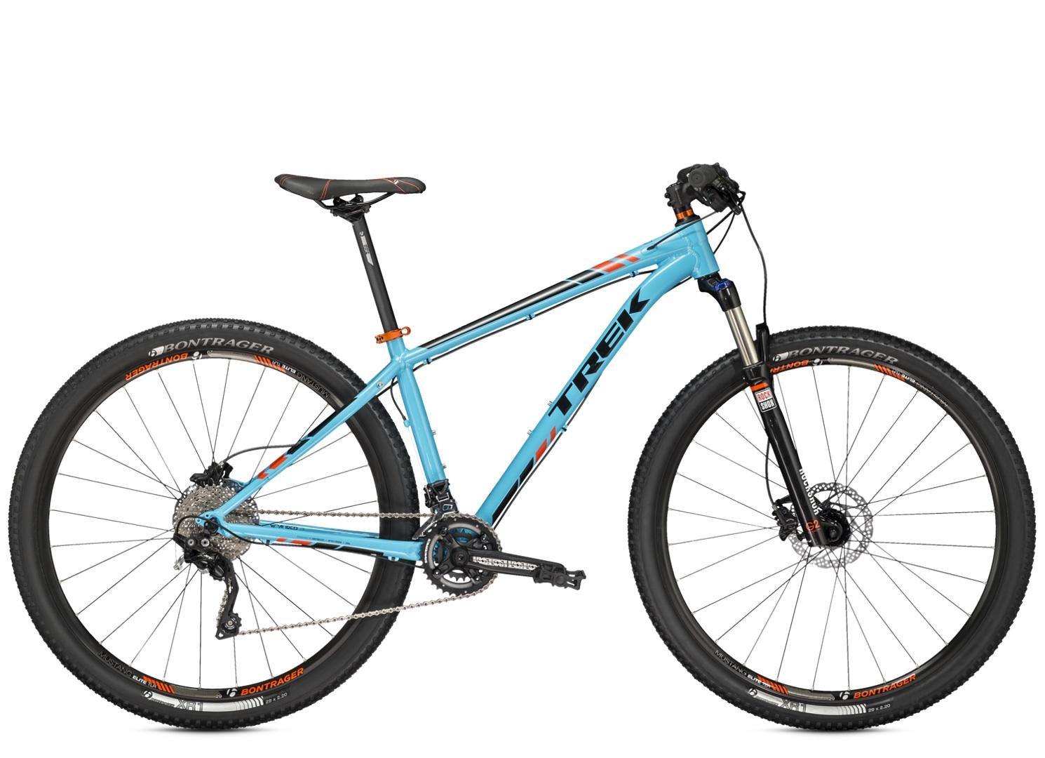 Trek X-Caliber 9: Alt tag: A blue Trek mountain bike featuring a lightweight frame, front suspension, and knobby tires, positioned against a plain background.