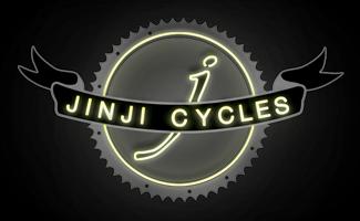 Logo for Jinji Cycles featuring a stylized letter "j" inside a circular gear design, with the name "JINJI CYCLES" displayed on a ribbon banner below. The logo is presented with a neon effect against a dark background.