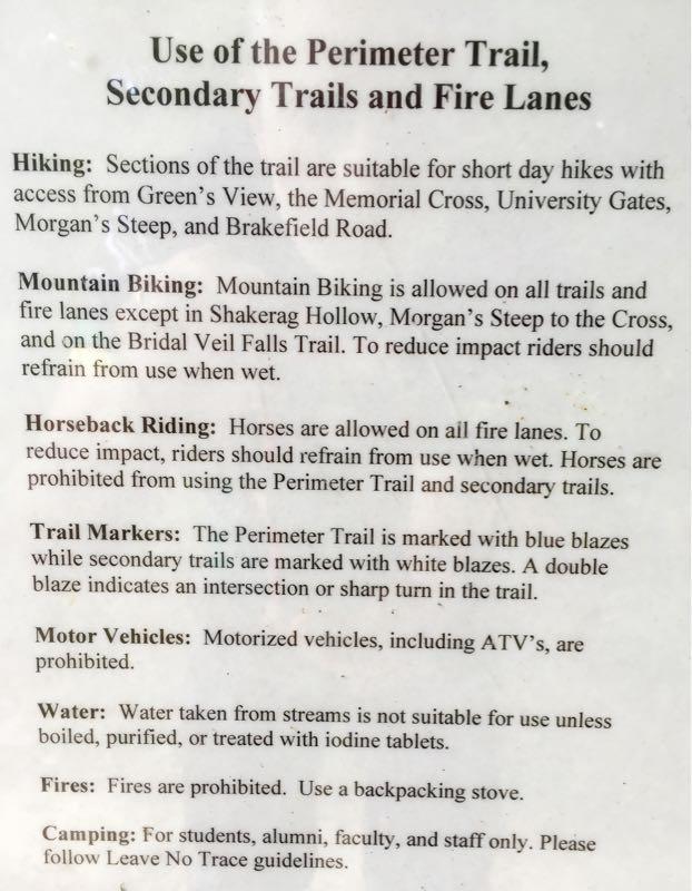 Signage detailing the rules and regulations for using the Perimeter Trail, Secondary Trails, and Fire Lanes, including guidelines for hiking, mountain biking, horseback riding, trail markers, motor vehicle restrictions, water safety, fire regulations, and camping policies. perimeter TrIl mountain bike trail.
