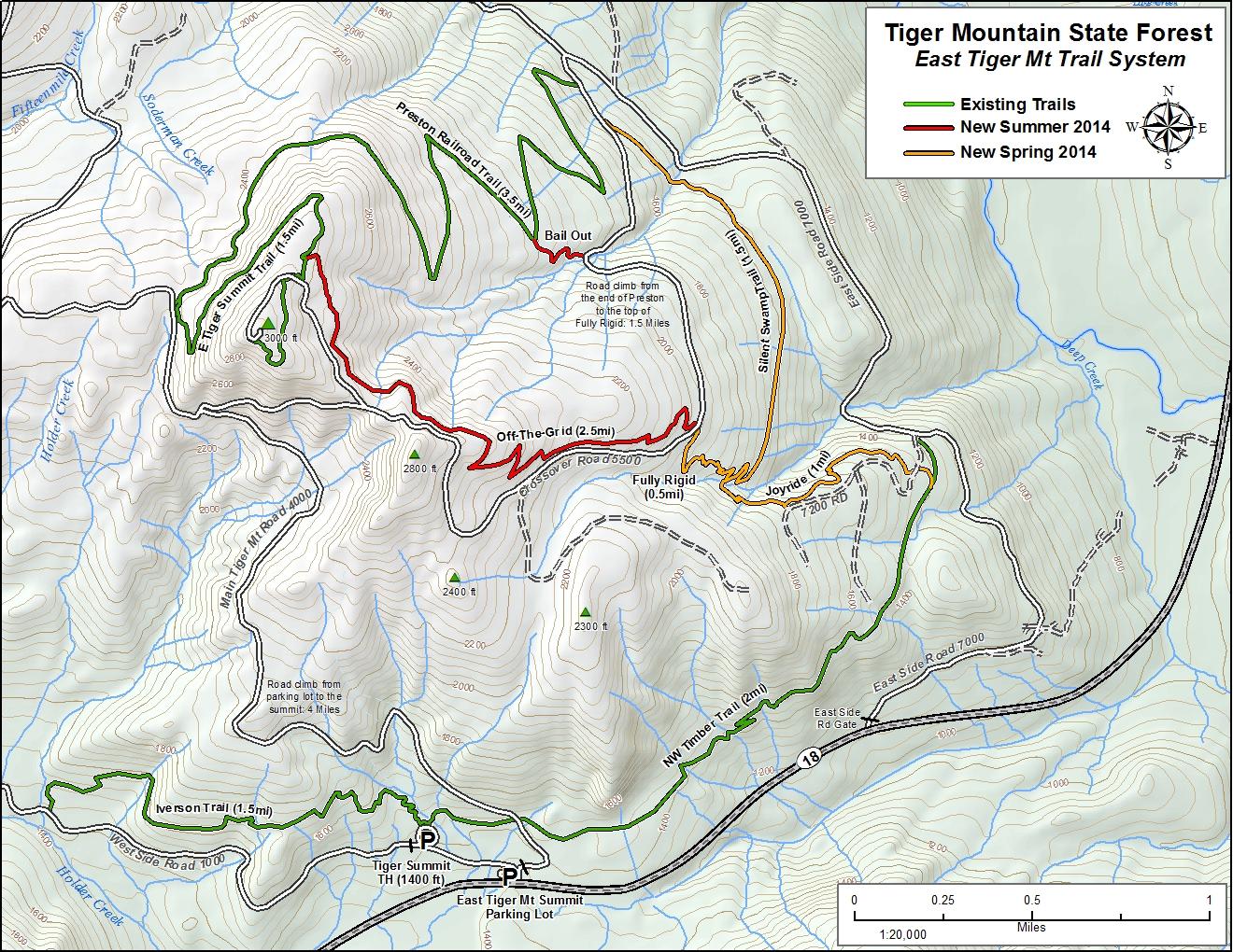 Map of the East Tiger Mountain Trail System in Tiger Mountain State Forest, featuring existing and newly established trails, including the Tiger Summit Trail and Off-The-Grid Trail. The map displays elevation contours, trail lengths, and notable points of interest, with a compass rose indicating direction. Tiger Mountain mountain bike trail.