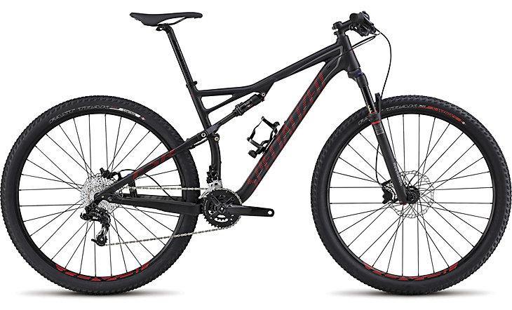 Specialized Epic Comp 29er: A black mountain bike with red accents, featuring a lightweight frame, dual suspension, and wide tires designed for off-road terrain. The bike has a modern design, with a prominent fork and a variety of gears for versatile riding.
