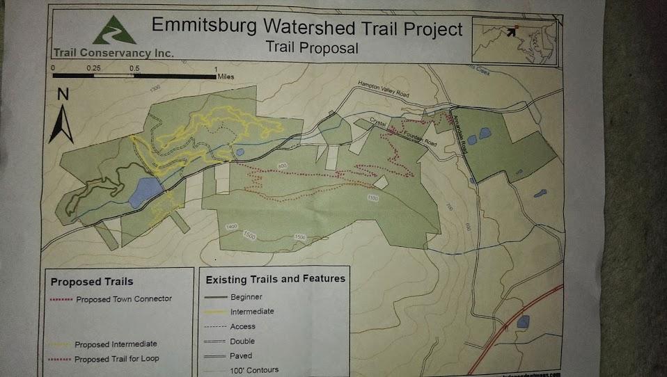 Map of the Emmitsburg Watershed Trail Project, showing proposed and existing trails, including a proposed town connector, intermediate trails, and other trail features. The map includes topographical details and a legend for trail classifications. Emmitsburg Watershed mountain bike trail.
