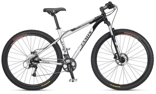 Jamis Durango 29er: Alt text: Mountain bike with a silver and black frame, featuring thick tires, disc brakes, and a gear system, positioned on a white background.