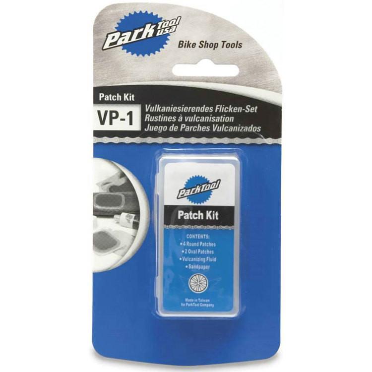 Park VP-1 Vulcanizing Patch Kit: A patch kit for bicycles, featuring a package labeled "Park Tool VP-1." The kit includes four round patches, two oval patches, vulcanizing fluid, and sandpaper, all designed for repairing punctured bicycle inner tubes. The packaging has a sleek design with a blue background and images of the patches on the side.