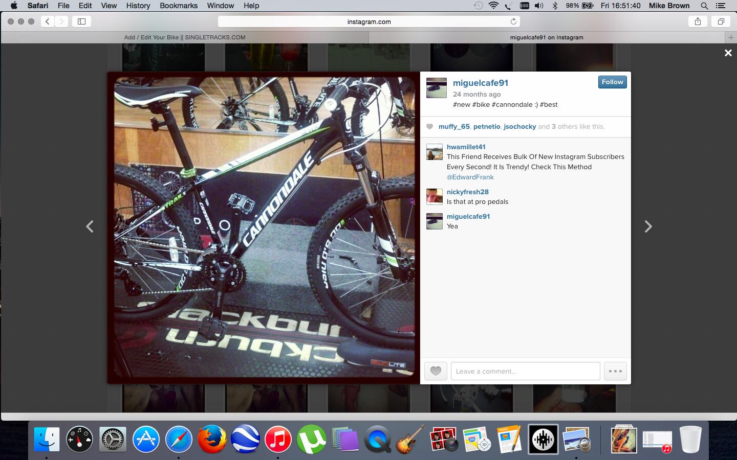 Cannondale Trail: Mountain bike displayed in a bike shop, featuring a sleek black and green design with "Cannondale" branding. The bike is positioned on a textured flooring surface with the name "Backcountry" visible. Various bike components, including the gears and pedals, are also visible in the image.