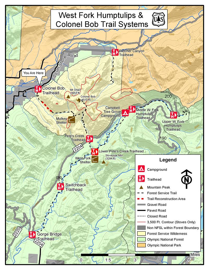 Map of the West Fork Humptulips and Colonel Bob Trail Systems, featuring trailheads, campgrounds, mountain peaks, and various trail types. Includes a legend indicating symbols for trailheads, forest service trails, and road types, along with elevation contours and key landmarks like Stovepipe Mountain. West Fork Humptulips mountain bike trail.