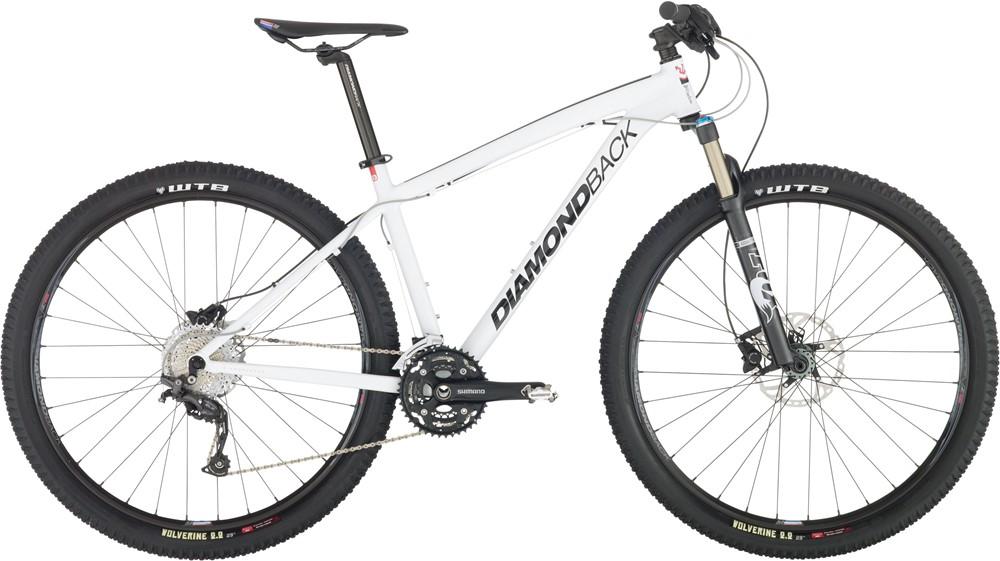 Diamondback Overdrive Pro: A side view of a Diamondback mountain bike featuring a white frame, black wheels with WTB tires, and a Shimano drivetrain. The bike has a front suspension fork and is designed for off-road cycling.