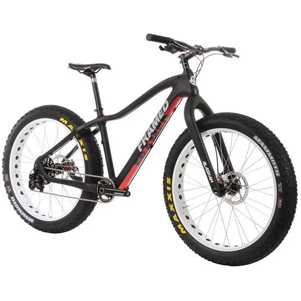 Framed Alaskan Carbon: Alt tag: A black and red framed fat bike with oversized white and black tires, featuring a sleek design and a modern handlebar setup, ideal for off-road cycling.