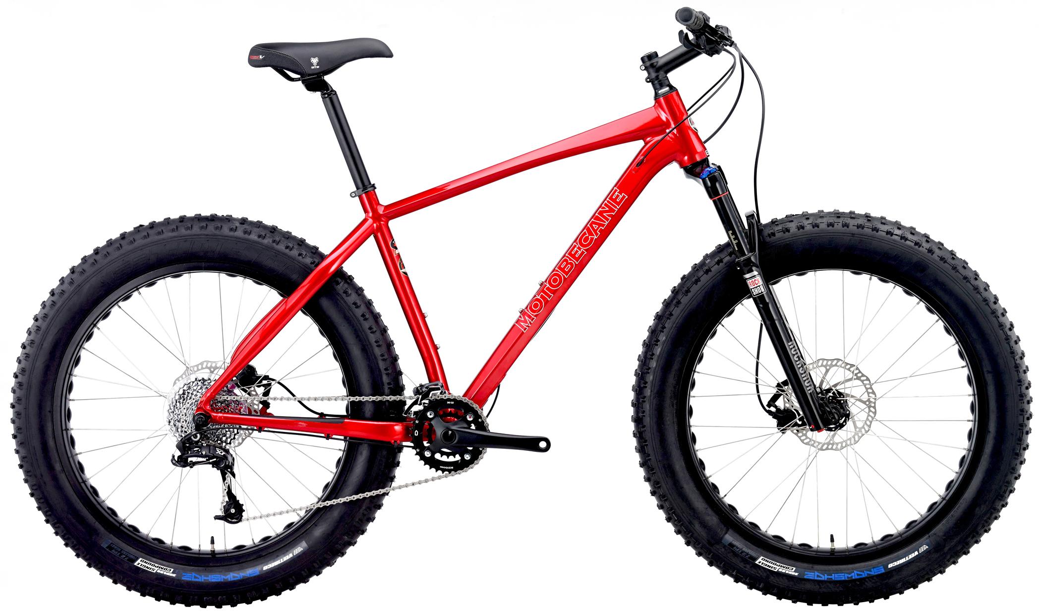 Motobecane Sturgis Bullet: A bright red fat bike with wide tires, featuring a lightweight frame and a front suspension fork. The bike includes a black seat, a chain drivetrain, and disc brakes.