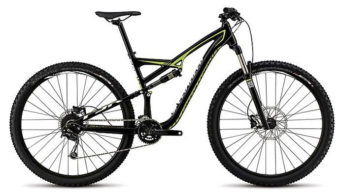 Specialized Camber 29: A black and lime green mountain bike with a sleek design, featuring wide tires, disc brakes, and a modern frame suitable for off-road cycling.