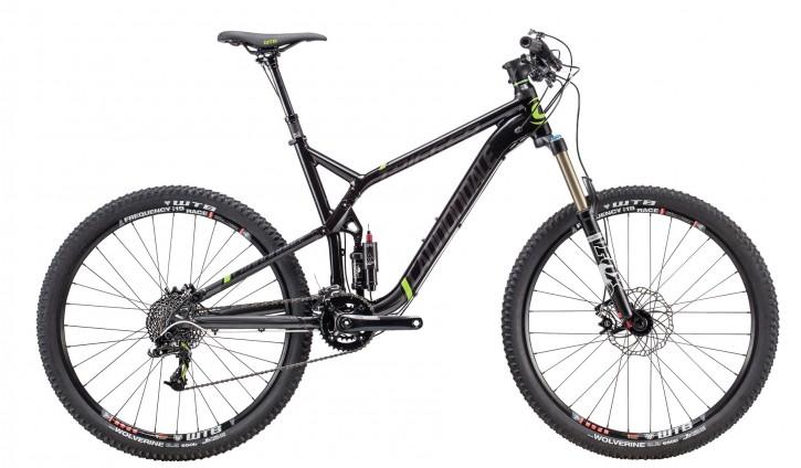 Cannondale Trigger 27.5 3: A modern mountain bike with a sleek black frame featuring green accents, equipped with wide tires and suspension for rugged terrain. The bike showcases a single front suspension fork and a rear shock, designed for performance on trails.