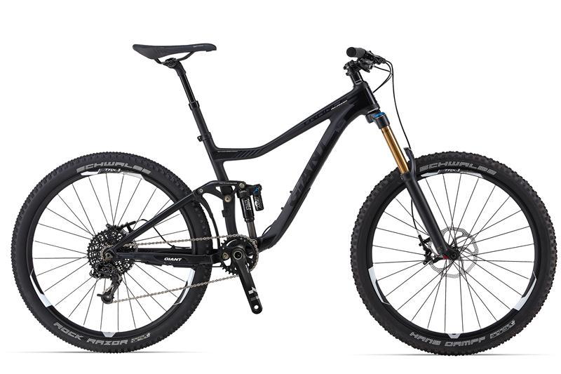 A black mountain bike with a sleek design, featuring dual suspension, wide tires, and high-quality components. The bike is positioned on a white background, showcasing its frame geometry, disc brakes, and gear system.