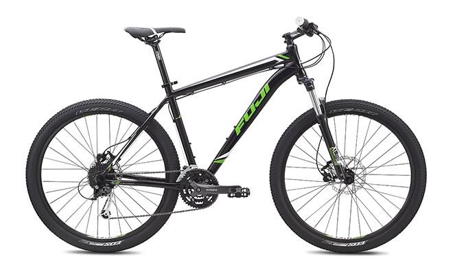 Fuji Nevada 27-5 1.5: Alt tag: A black and green mountain bike with disc brakes, a sturdy frame, and wide tires, shown from the side on a white background.