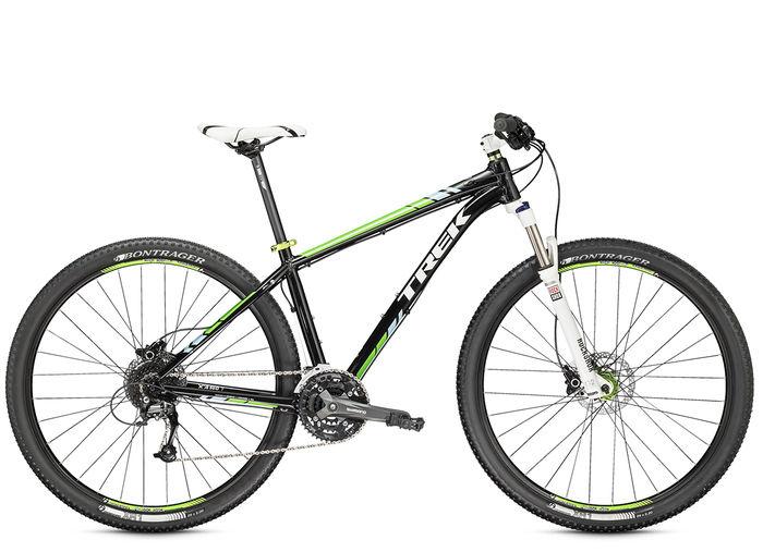 Trek X-Caliber 7: Alt tag: "A black and green Trek mountain bike, featuring a lightweight frame, front suspension fork, and Bontrager tires, positioned on a white background."