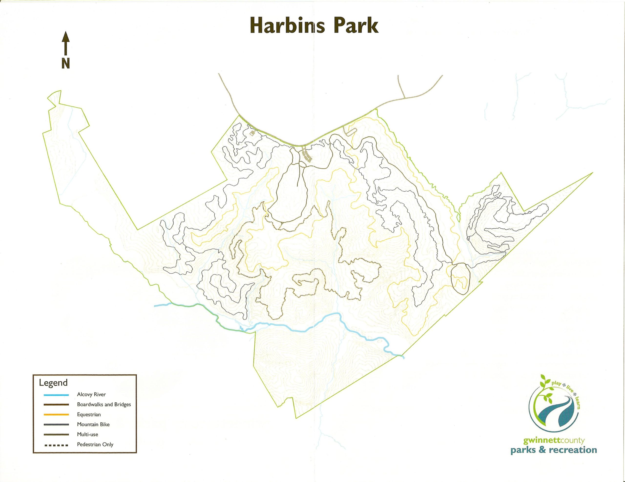 Map of Harbins Park displaying trail routes for various activities such as hiking, biking, and equestrian use. The map includes a legend indicating trail types, boardwalks, and waterways, with the Alcovy River shown in blue. North is oriented at the top. Harbins Park mountain bike trail.