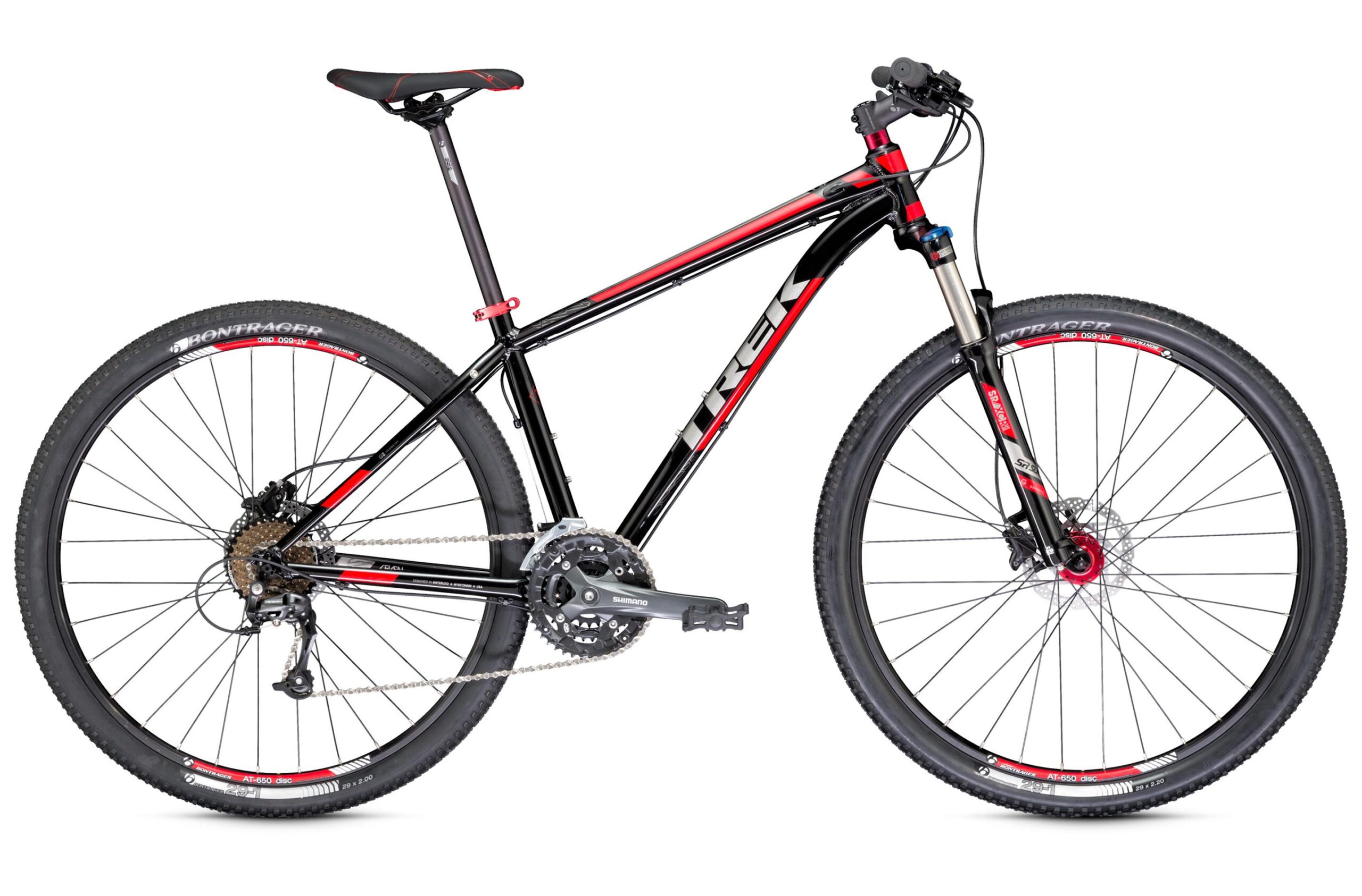 Trek Excalibur: A black and red mountain bike with a sleek aluminum frame, featuring a front suspension fork, disc brakes, and wide tires designed for off-road terrain. The bike is positioned against a white background, showcasing its design and components clearly.