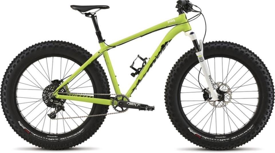 Specialized Fatboy Pro: Alt text: A vibrant green fat bike with wide tires, featuring a sleek frame, front suspension, and a single gear setup, positioned against a white background.
