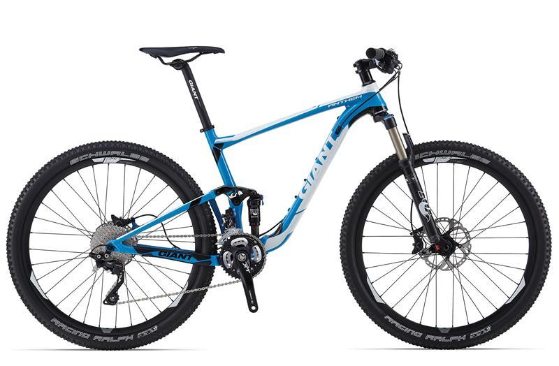 Giant Anthem 27.5 3: A blue and white mountain bike with a lightweight frame, front suspension, and disc brakes. The bike features knobby tires suitable for off-road terrain and has gear shifters on the handlebars.