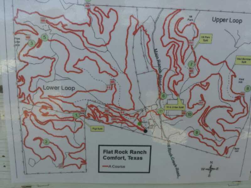 Map of Flat Rock Ranch in Comfort, Texas, displaying the A Course layout. The map features winding paths for cycling or hiking marked in red, with numbered key points indicating various locations and trails, including the Upper Loop and Lower Loop. A small legend identifies the start point and directional indicators. Flat Rock Ranch mountain bike trail.