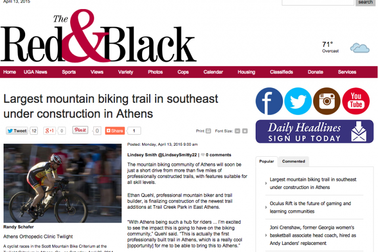 A cyclist competing in the Scott Mountain Bike Criterium in Athens, Georgia, while wearing a racing jersey and helmet. The image is part of an article discussing the construction of the largest mountain biking trail in the southeast, highlighting features for bikers of all skill levels.