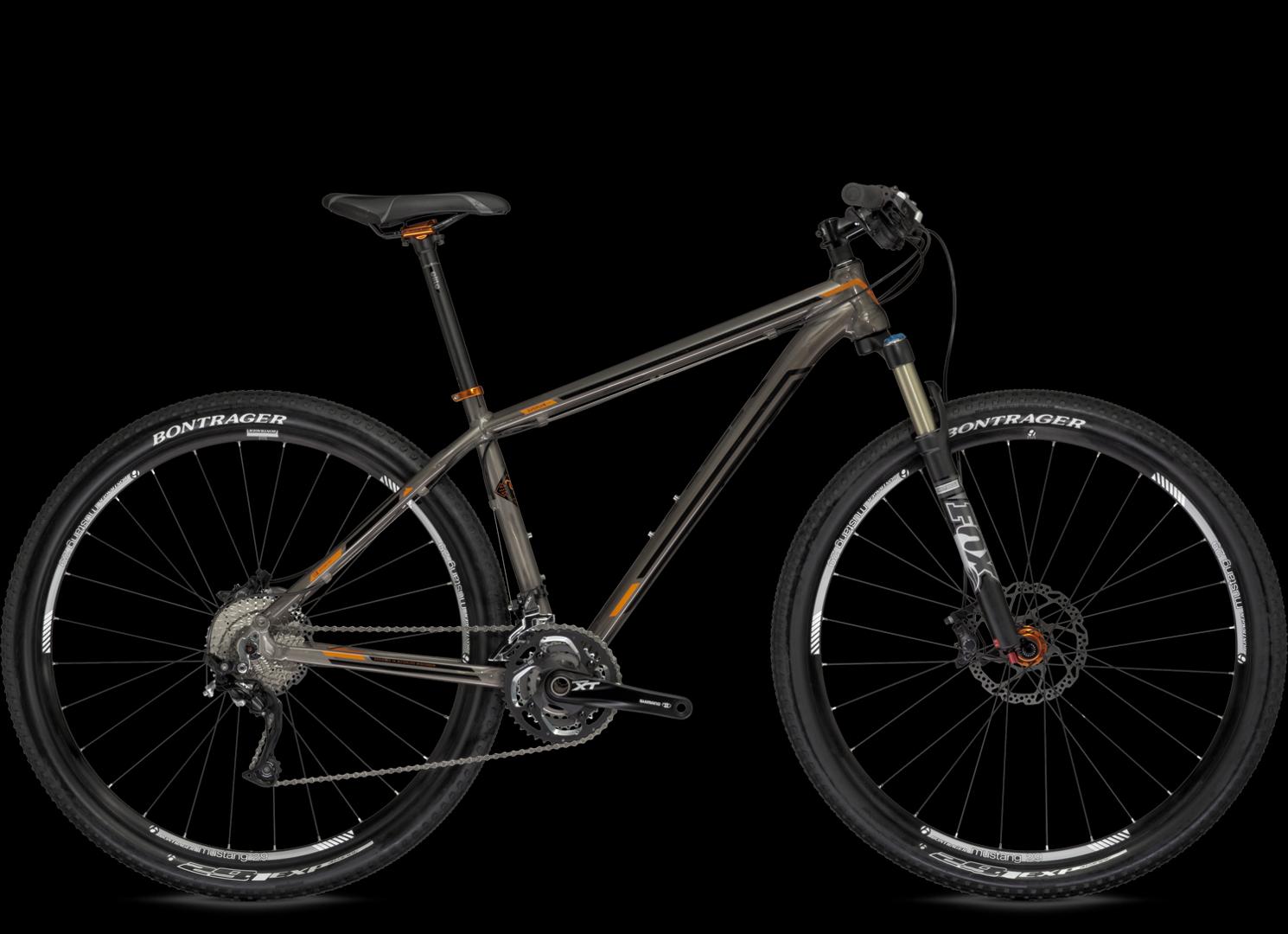 Trek Superfly AL Elite: A modern mountain bike featuring a sleek metallic gray frame with orange accents, equipped with front suspension, wide tires, and disc brakes. The bike is displayed against a black background.
