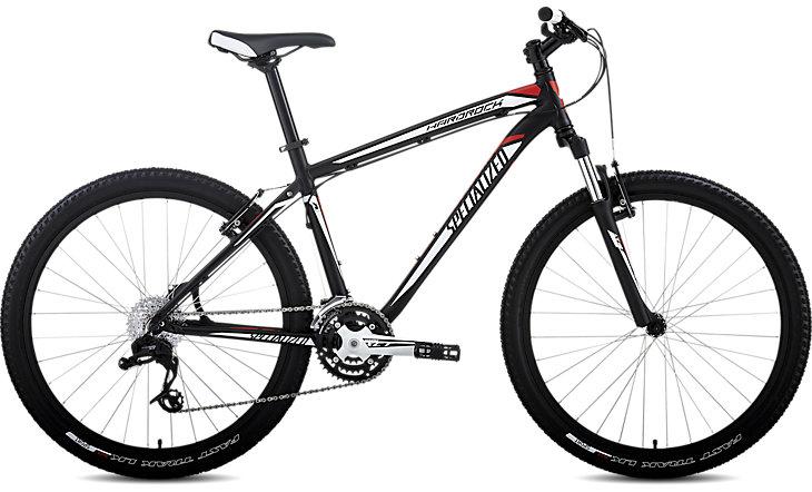 Specialized hardrock: Alt text: A black and red mountain bike featuring a lightweight frame, thick tires, and front suspension, positioned against a neutral background.