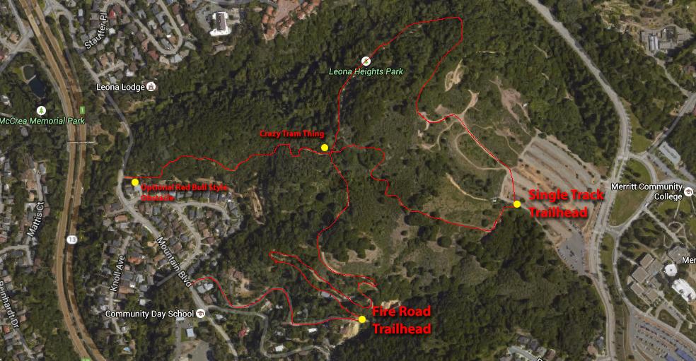 Aerial map of a wooded area showing bike trails, including the Crazy Tram Trail and Single Track Trailhead, with marked locations for the Fire Road Trailhead and a red bull style bike jump, surrounded by residential neighborhoods and parks. Leona mountain bike trail.