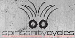 Logo for Spinsanity Cycles, featuring two bicycle gears with chain links radiating above them, set against a textured gray background. The text "spinsanity cycles" is displayed prominently below the design.