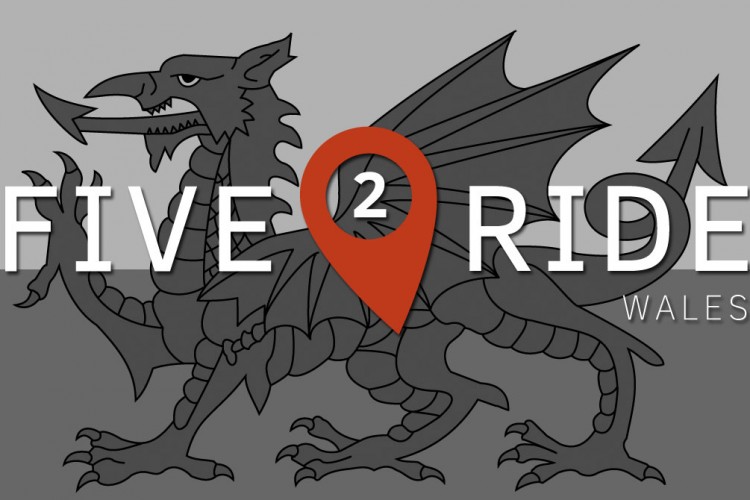A graphic featuring a stylized Welsh dragon alongside the text "FIVE² RIDE WALES." The dragon is depicted in black on a grey background, and a location pin symbol in red highlights the "2" in "FIVE²."