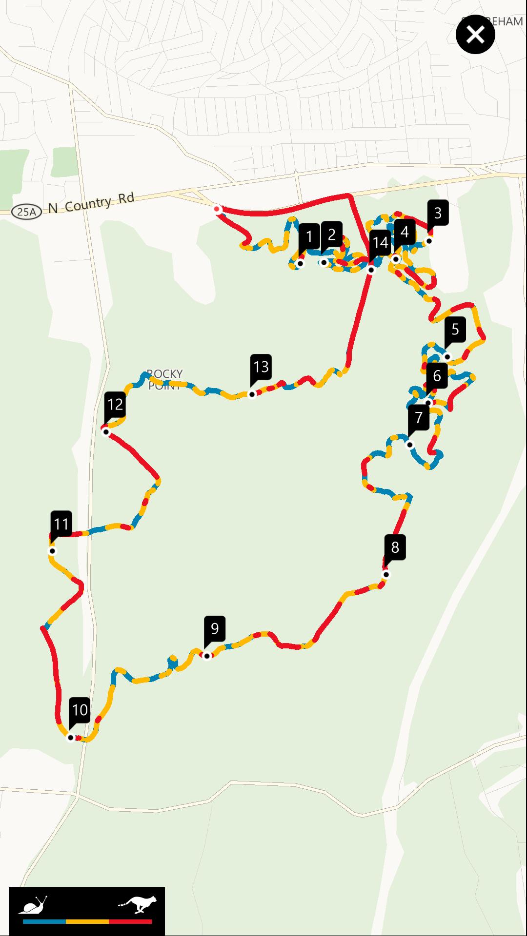 Map showing a trail route with numbered markers and different colored paths representing various segments of the trail. The map includes features such as roads, and is oriented in a way that highlights the trail's twists and turns through a natural area. Rocky Point mountain bike trail.