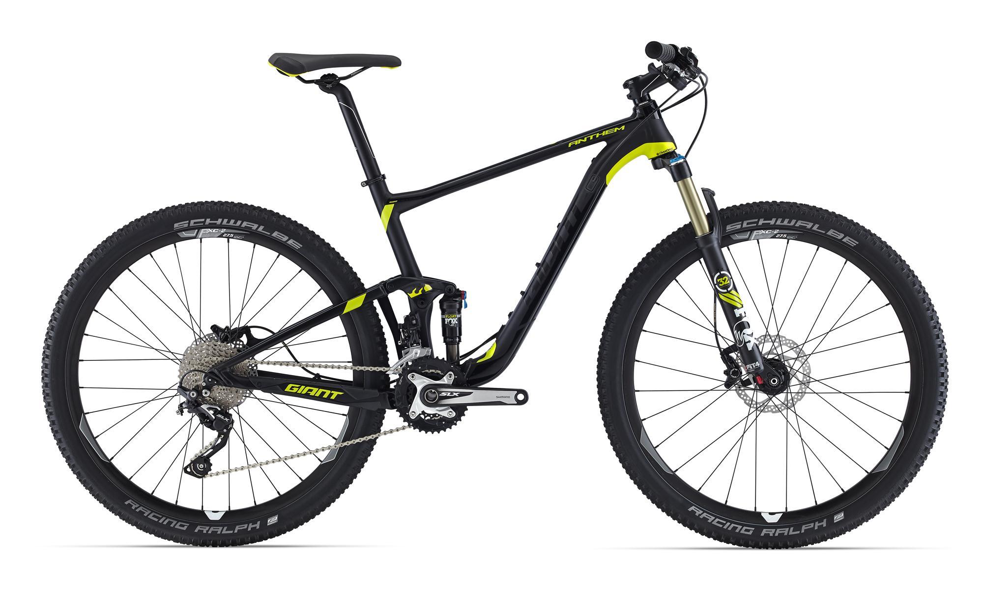 Giant Anthem 27.5 2: Mountain bike with a black and yellow frame, featuring front suspension, disc brakes, and wide, knobby tires. The bike is shown from the side, highlighting its sporty design and durable components.