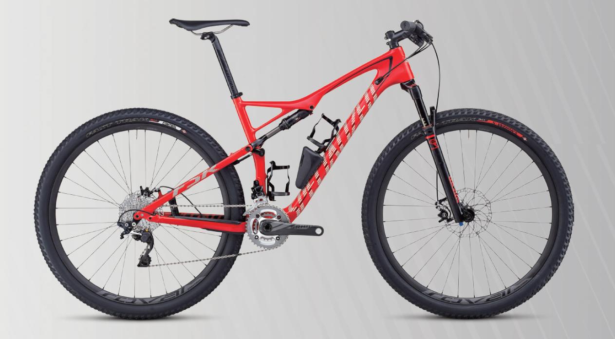 Specialized FSR Expert 29er: A modern mountain bike with a red frame and black accents, featuring thick tires, disc brakes, and a visible rear suspension system. The bike is positioned against a light gray background, showcasing its design and components.