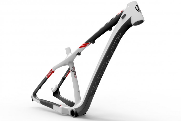 A close-up image of a modern bicycle frame, featuring a sleek design in a combination of white and black, with red accents. The frame has a distinctive geometric shape, showcasing areas for cable routing and mounting points. The branding "Fatback" is prominently displayed along the side. The background is plain white, emphasizing the frame's design and details.