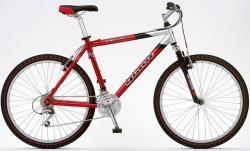 Giant 2000 Giant Rincon: A red and silver mountain bike with a sturdy frame, front suspension, and knobby tires, positioned against a white background.