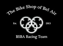 Logo for The Bike Shop of Bel Air featuring interlocking bicycle gears, with the text "The Bike Shop of Bel Air," "Est. 2013," and "BSBA Racing Team" displayed above and below the gears. The background is black.