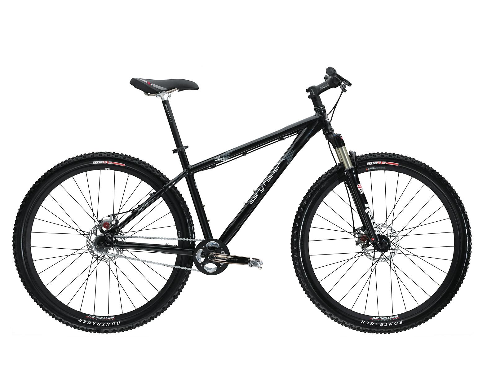 Gary Fisher Rig 29er: A black mountain bike with wide tires and disc brakes, positioned against a white background. The bike features a lightweight frame, front suspension, and a sporty design suitable for off-road riding.